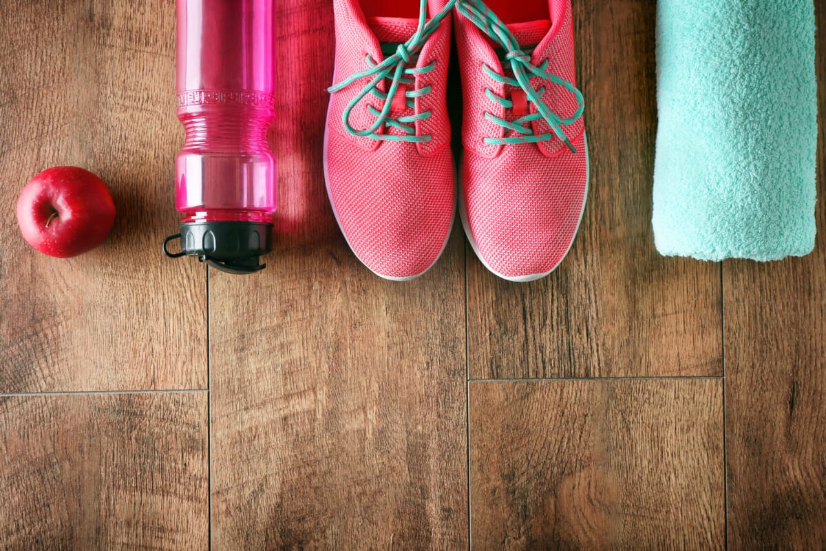 Fitness equipment on wooden background | コーヒーステーション