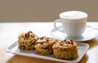 Traditional British cheese scones with blurry cup of coffee and | コーヒーステーション