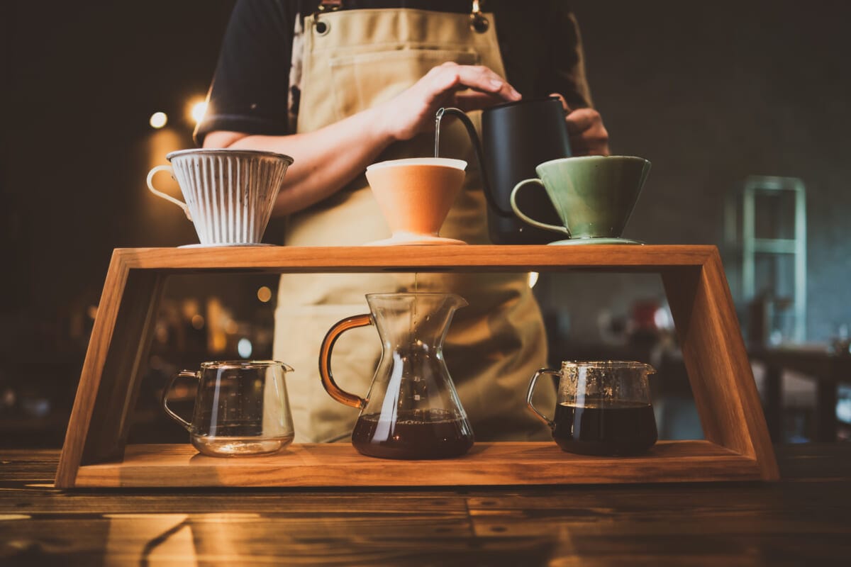 barista brewing a coffee filter drip in the morning beverage drink with fresh black espresso aroma hot drink in cup of cafes brown caffeine in bar shop background | コーヒーステーション