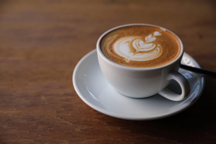 cappuccino or Latte art coffee made from milk on the wood table | コーヒーステーション