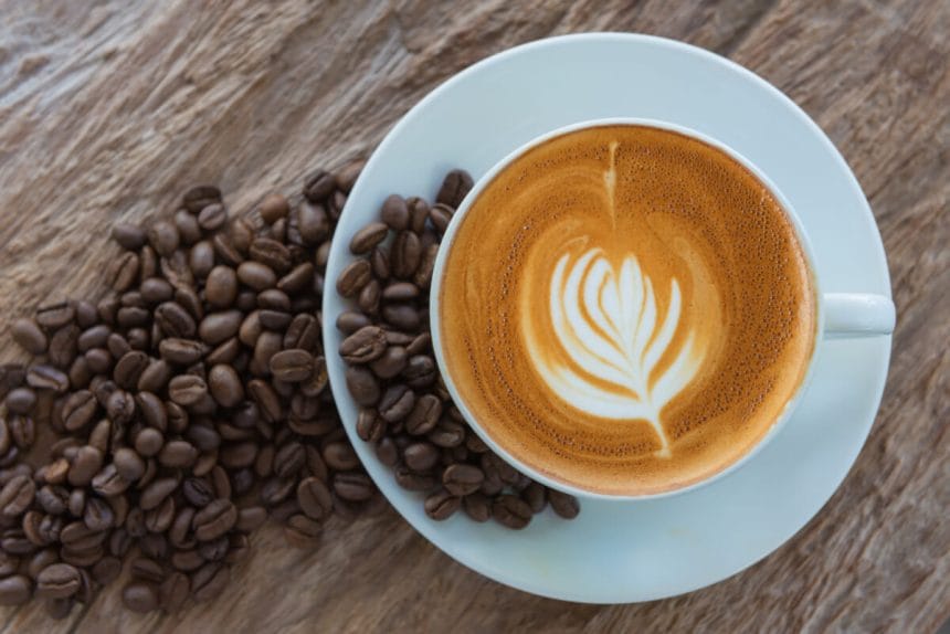 bean coffee with latte art or cappuccino on wooden table | コーヒーステーション