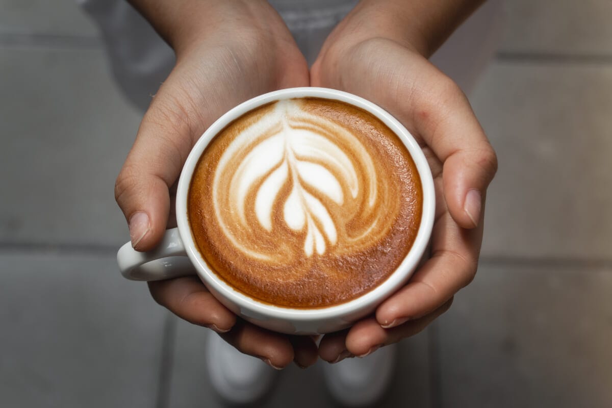 cup of coffee in hand | コーヒーステーション