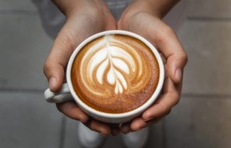 cup of coffee in hand | コーヒーステーション